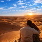 Couple watching sunset in desert