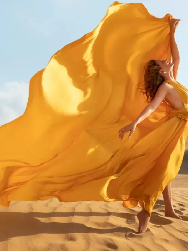 Woman in flowing yellow dress