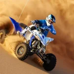 Dubai quad bike desert safari adventure on red dunes