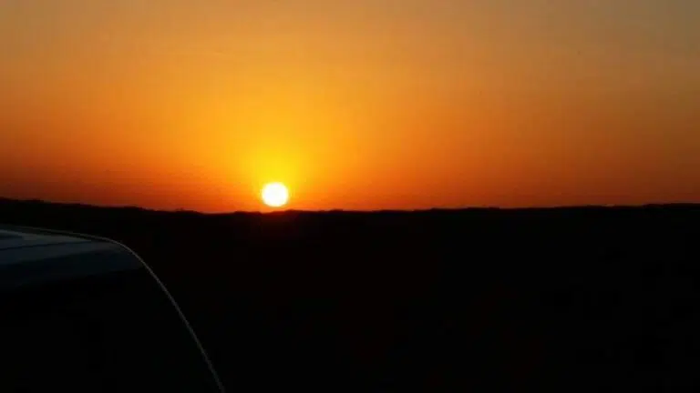 Sunrise view over Arabian desert dunes during morning desert safari in Dubai