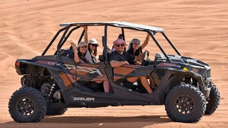 Seater-Polaris-RZR-1000-CC Off-road vehicle in sandy terrain. family ride