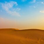 Golden dunes under a blue sky