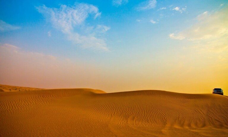 Golden dunes under a blue sky