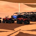 ATVs parked under a shade canopy