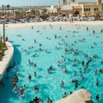 Crowded water park with pools and attractions