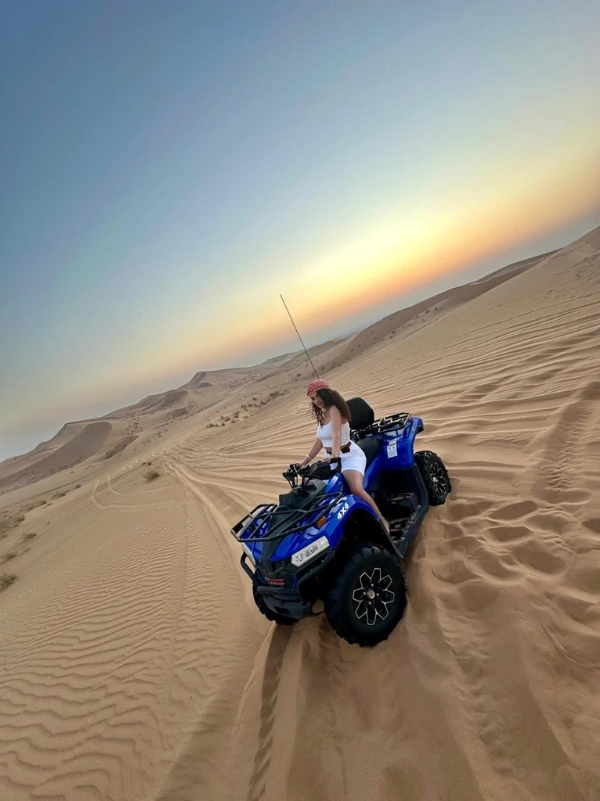 Quad biking on the sand dunes at a Dubai desert safari