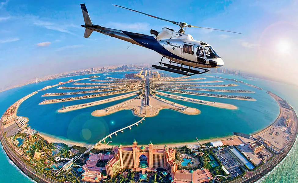 Helicopter flying over Palm Jumeirah and Atlantis The Palm, Dubai
