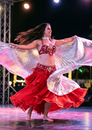 Traditional belly dance performance at a Dubai desert safari camp